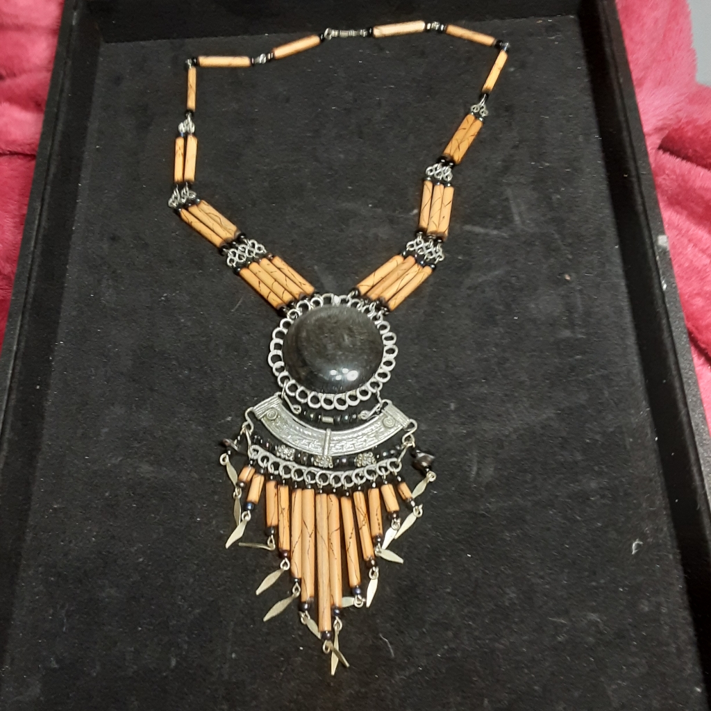 The Pendant Is Crafted From Bamboo